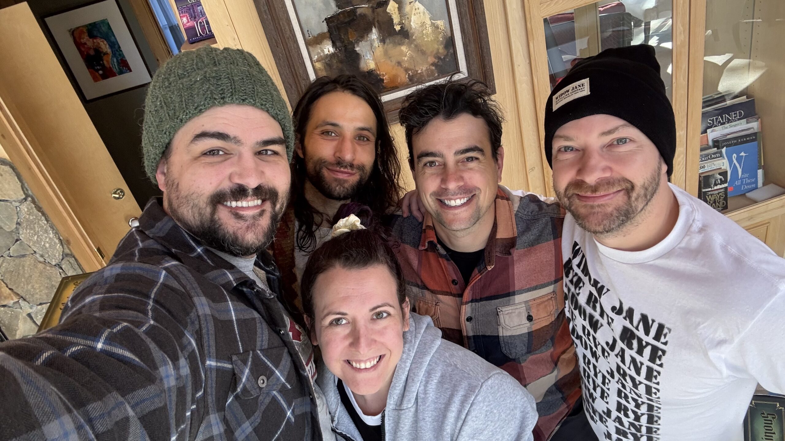 Group of friends smiling indoors.