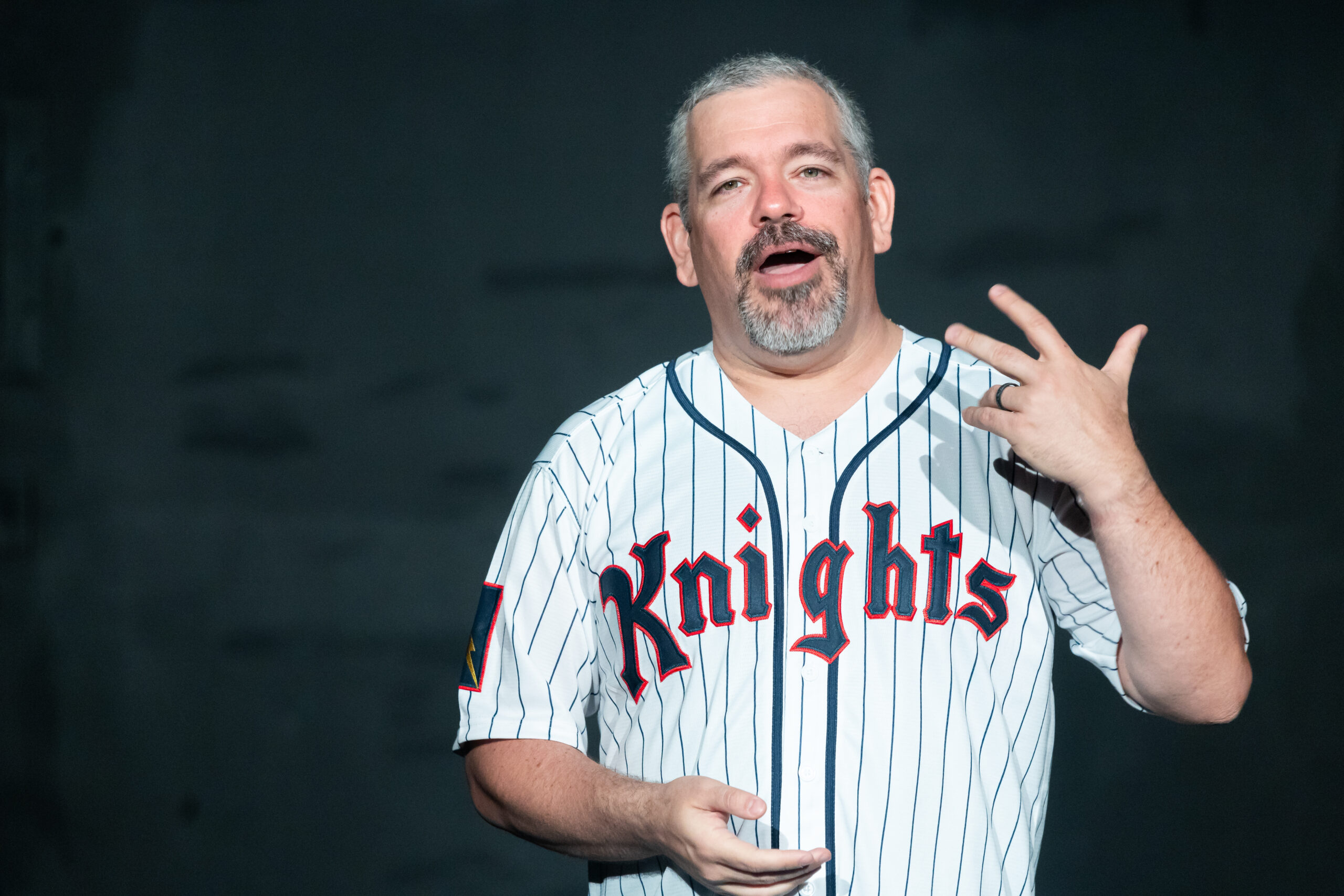 Man in Knights jersey gesturing passionately